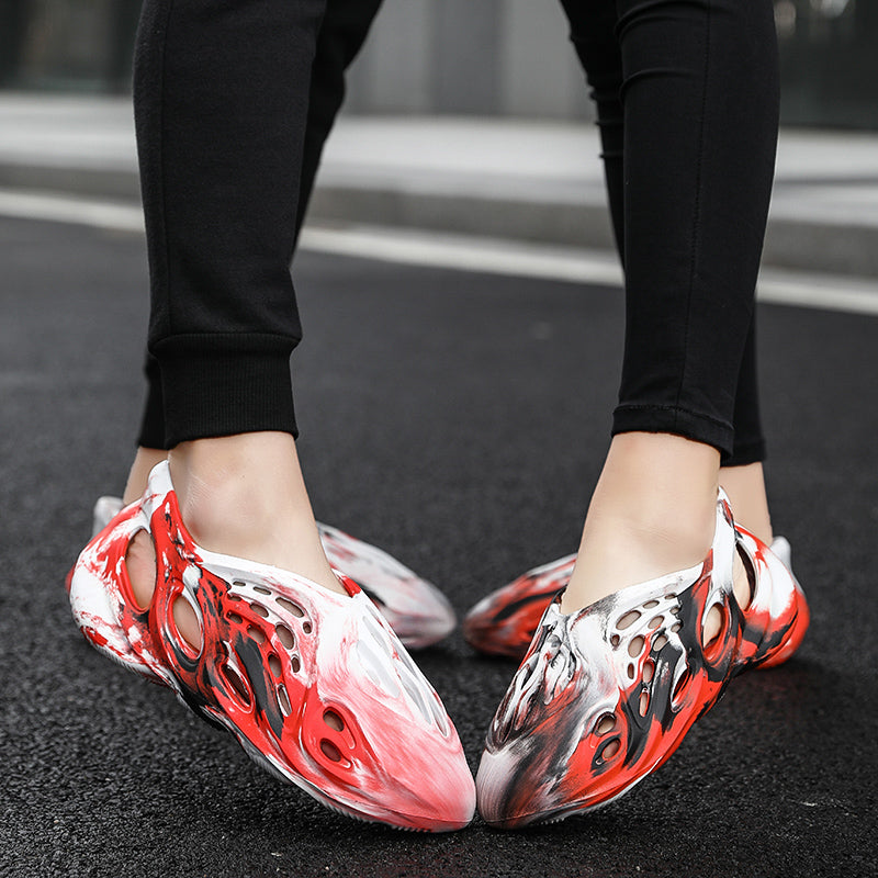 Side profile of Garuda Cloud T84 Foam Runners showing organic ventilation holes