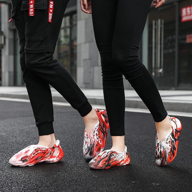 Side profile of Garuda Cloud T84 Foam Runners showing organic ventilation holes